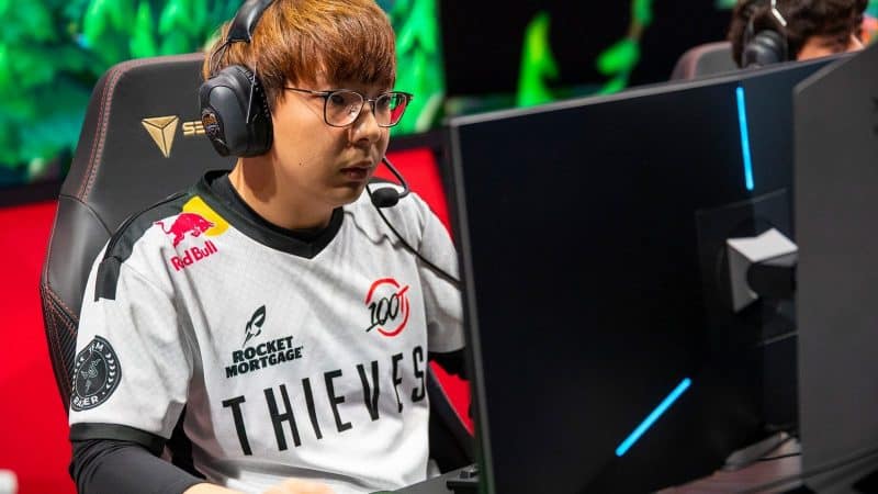 Pro LoL player for 100 Thieves Choi "huhi" Jae-hyun during an LCS match on stage.