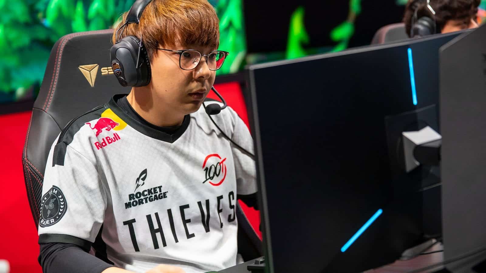 Pro LoL player for 100 Thieves Choi "huhi" Jae-hyun during an LCS match on stage.