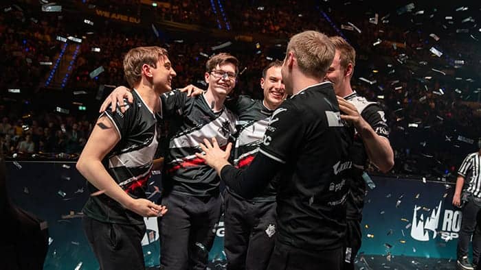 The G2 Esports League of Legends team of Wunder, Jankos, Caps, Perkz and Mikyx huddled together with confetti falling around them