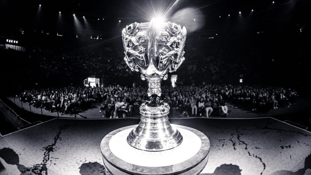 The League of Legends Summoner's Cup on a pedestal in front of an audience 