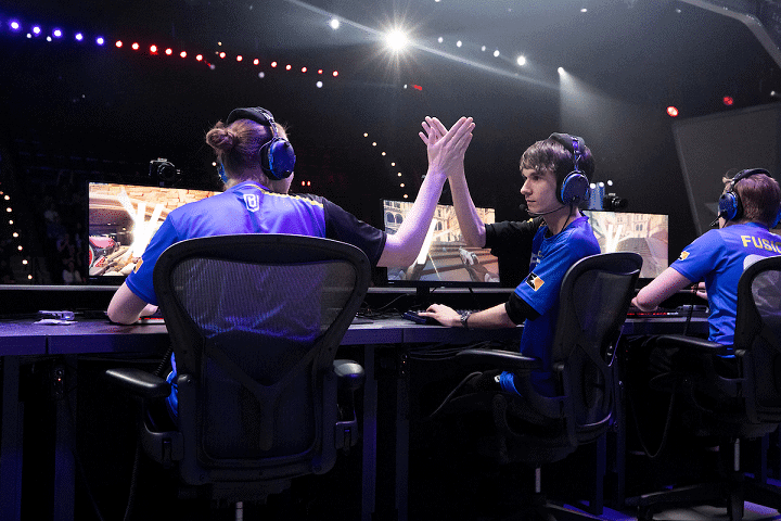 Axxiom and Fusions high five after a successful play