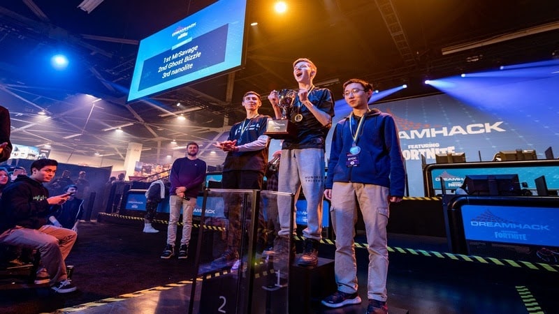 MrSavage stands on stage, cheering, after winning DreamHack Anaheim