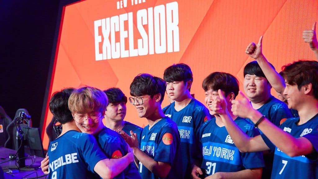 The New York Excelsior congratulate each other on stage after a win.