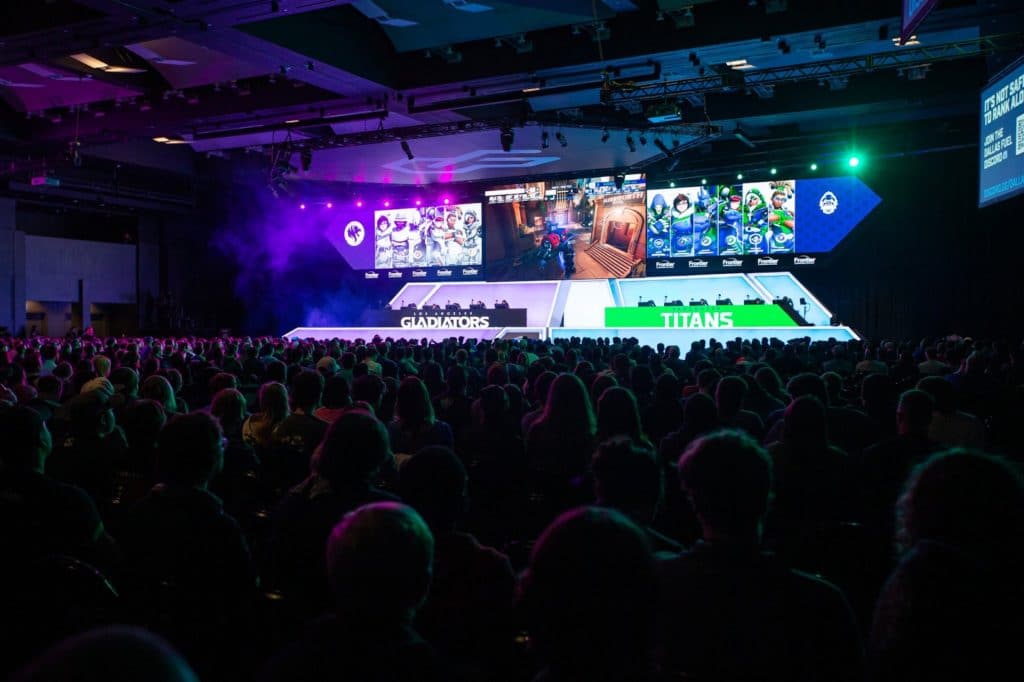 The crowd watch a match between the Los Angeles Gladiators and the Vancouver Titans live on stage.