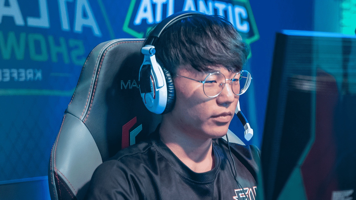 Alarm, sitting at the monitor with headset on, competiting during a Homestand