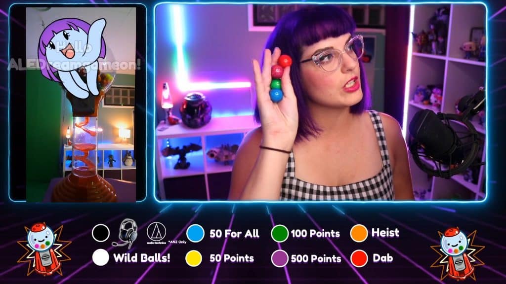 Naysy picking gumballs from her gumball machine on screen. An animated chibi octopus with purple hair waves to welcome a viewer in the top left corner