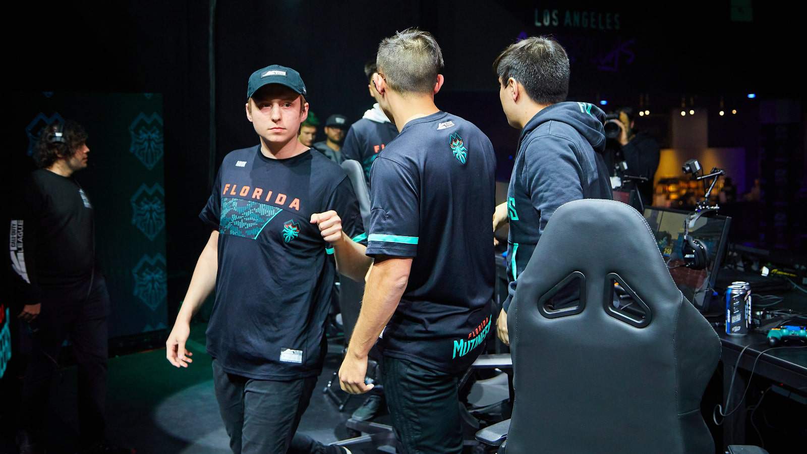 The roster of the Florida Mutineers congratulate each other after finishing a game