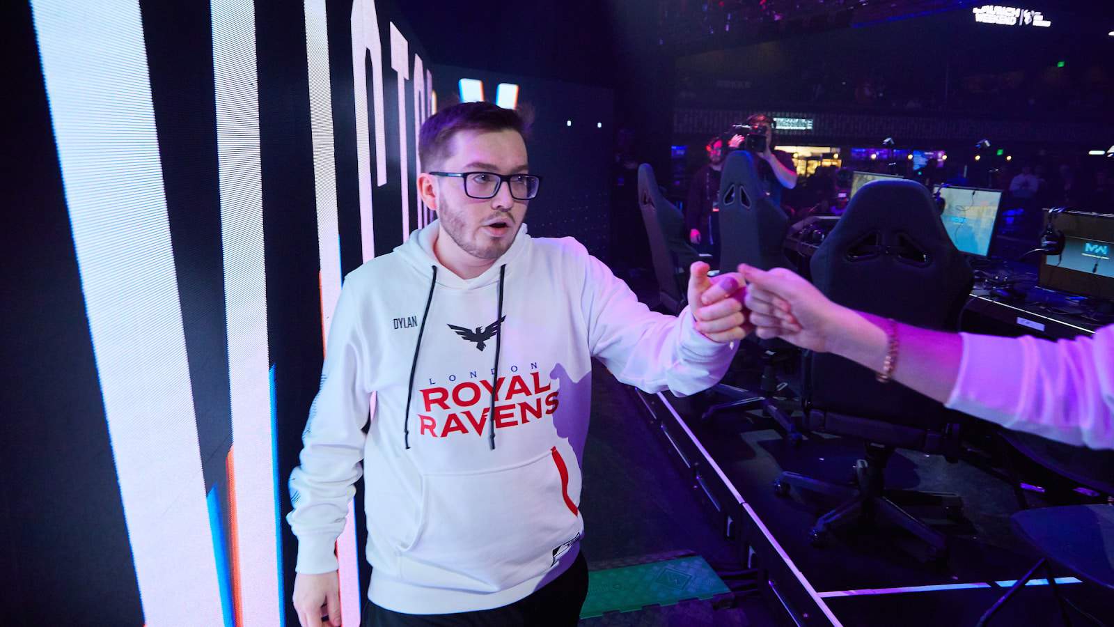 Dylan of the London Royal Ravens fist bumps team mates after a game