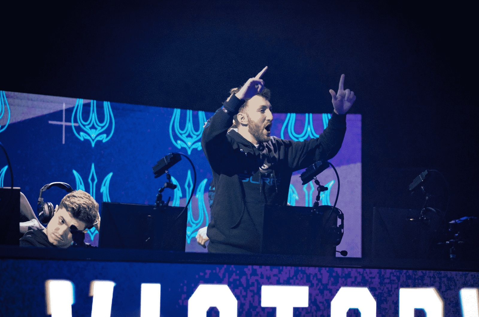 The Seattle Surge cheer on stage after taking a victory in the CDL