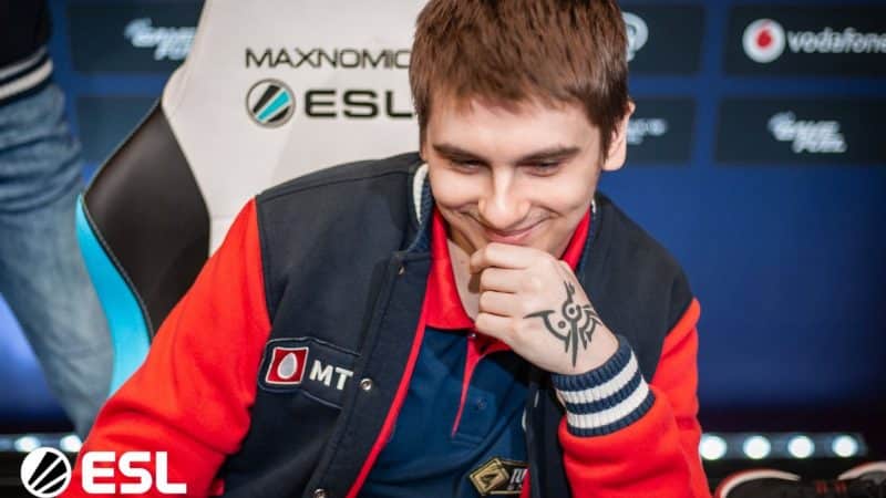 fng laughs as he watches a replay on his monitor at a previous ESL event