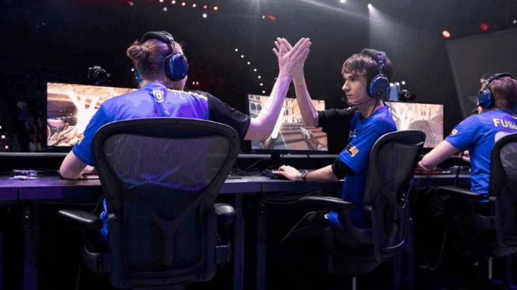 Brussen hi-5's and celebrates with team mates after Boston Uprising take a win.