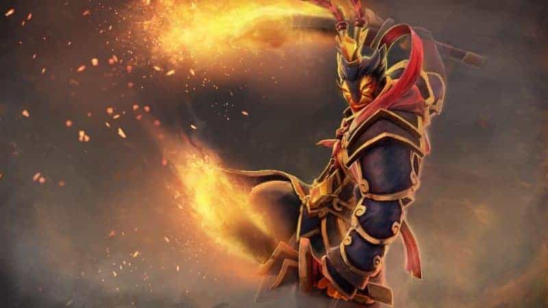 The Hero Ember Spirit sweeps toward the viewer, his twin swords drawn and wreathed in flames.