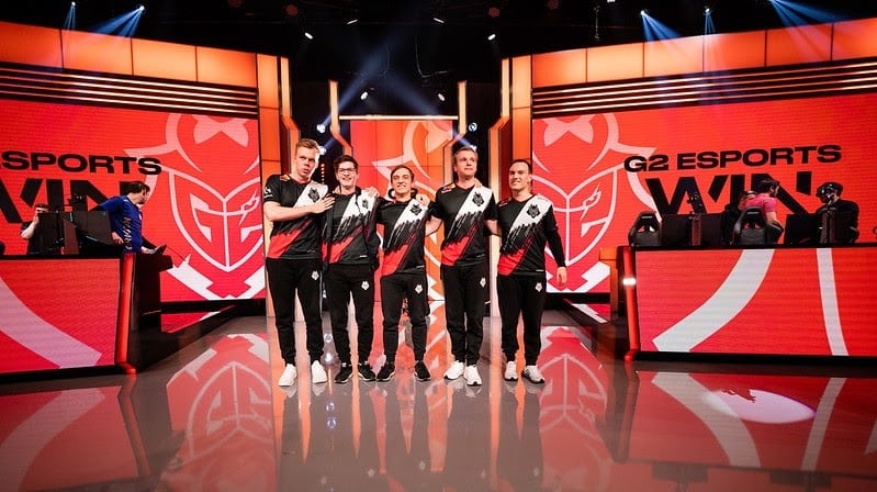The G2 Esports LoL roster lines up together after a win