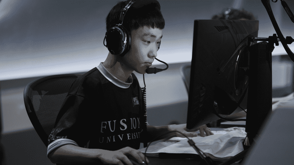 WhoRU sits with headset on, ready to play a round of Overwatch