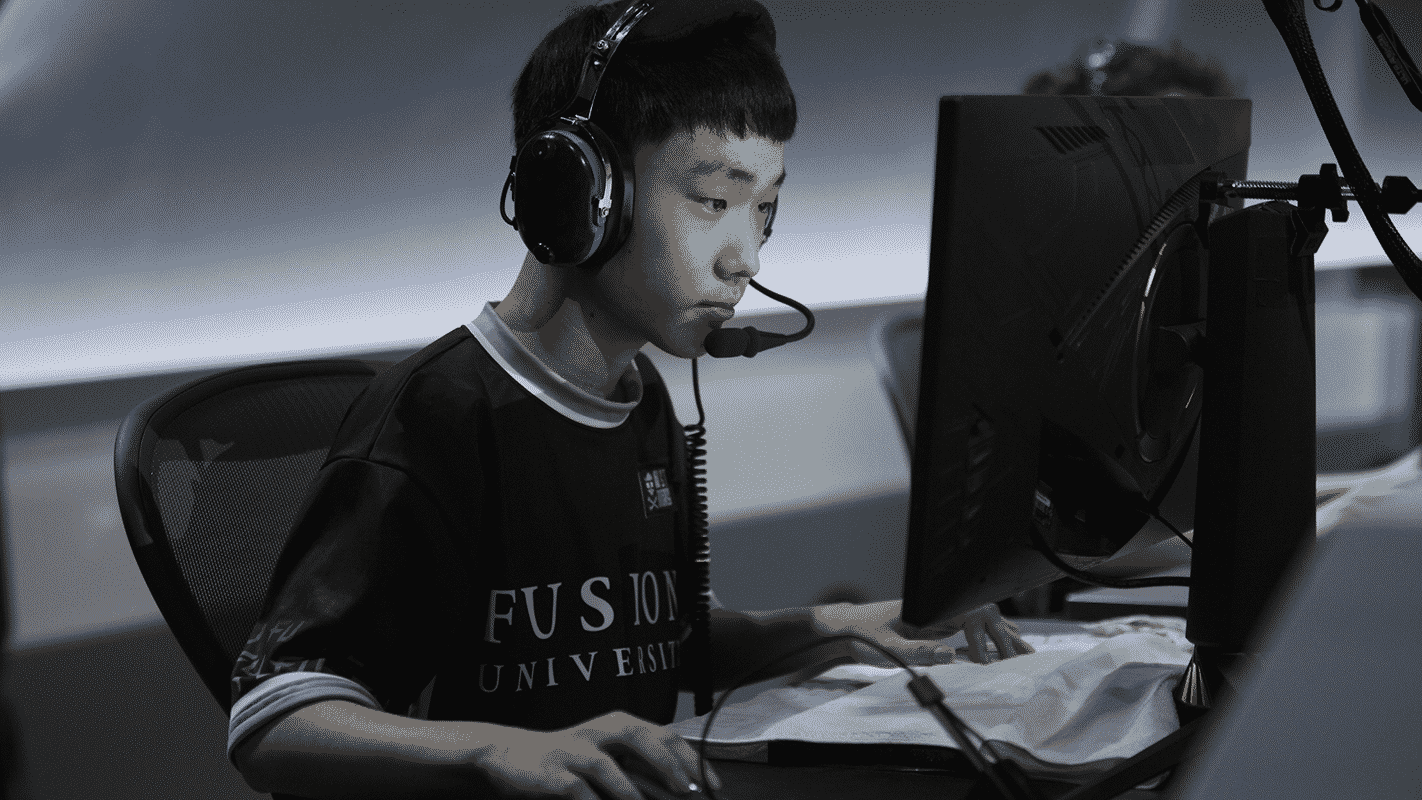 WhoRU sits with headset on, ready to play a round of Overwatch