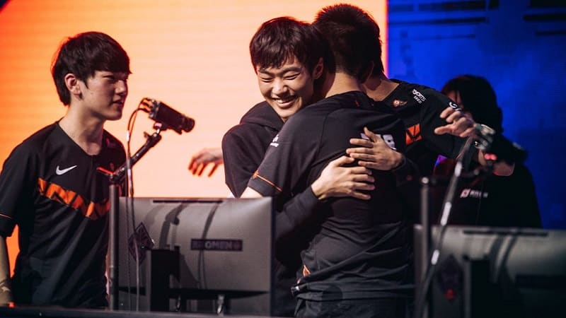 Top Esports Chinese LoL pro players hugging after a win