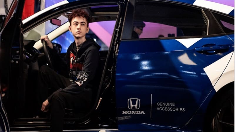 Pro Fortnite player Stretch sitting in an open car