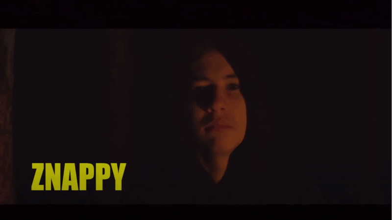 Pro Fortnite player Znappy with a hoodie on in a dark room