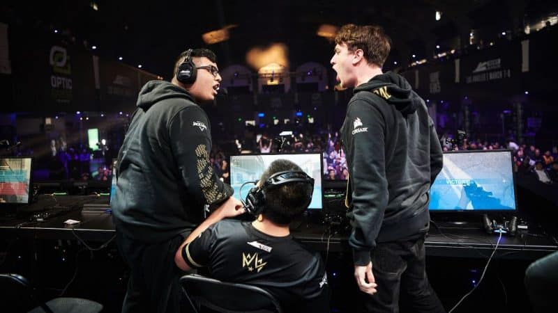 he Dallas Empire celebrate on stage with one another after a victory