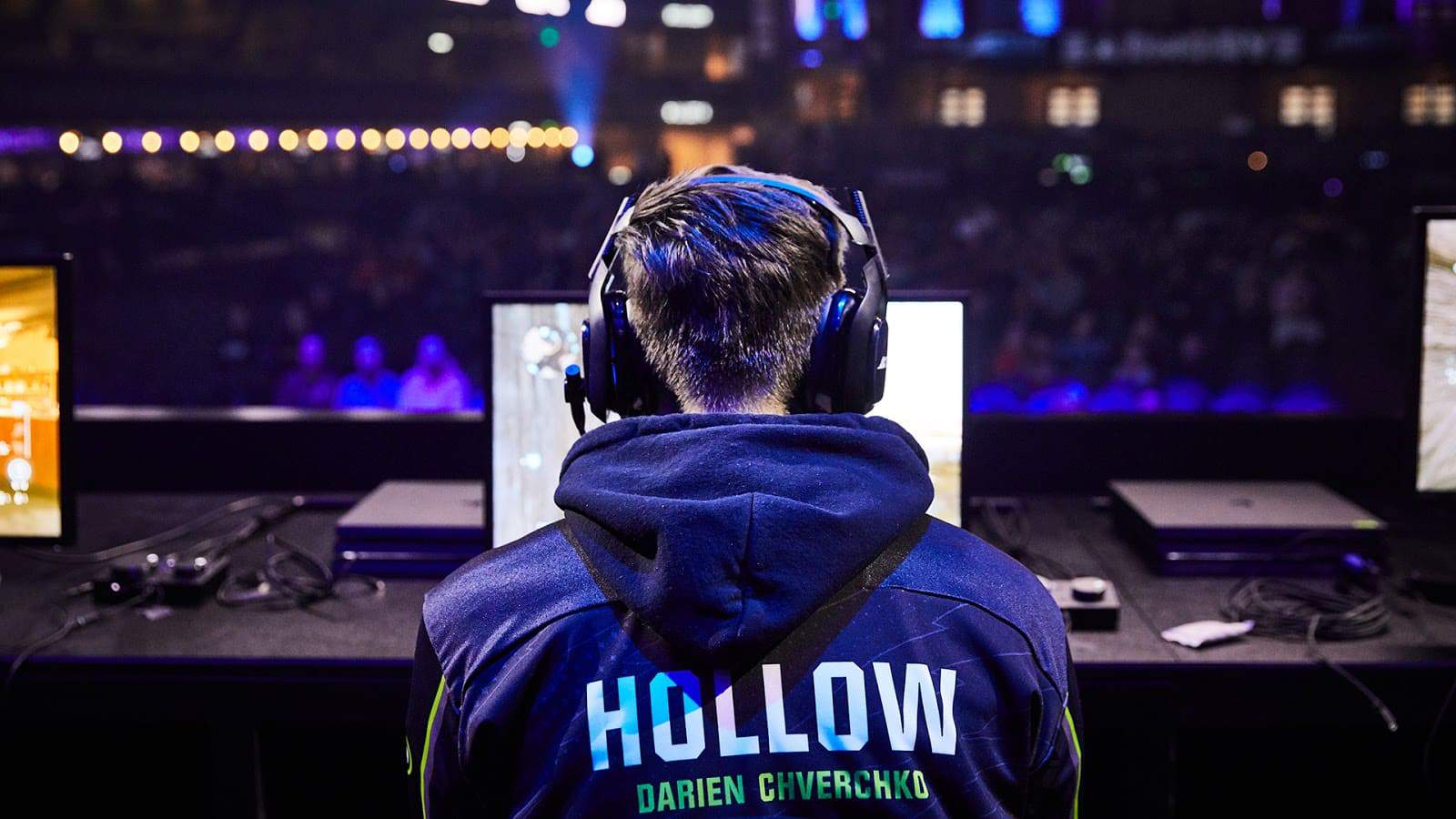 Darren "Hollow" Chverchko sits at his monitor on stage, ready to compete with the London Royal Ravens
