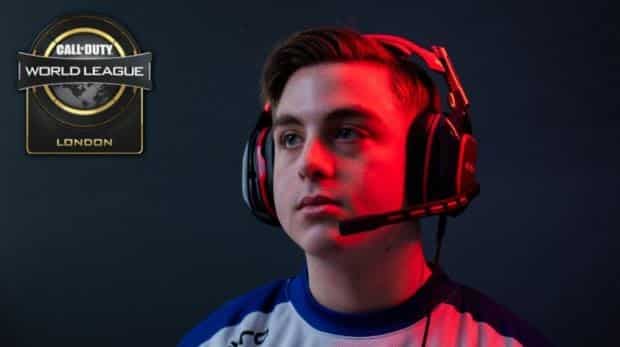 Chris “Simp” Lehr looks off into the distance as red stage lights shine down on his face