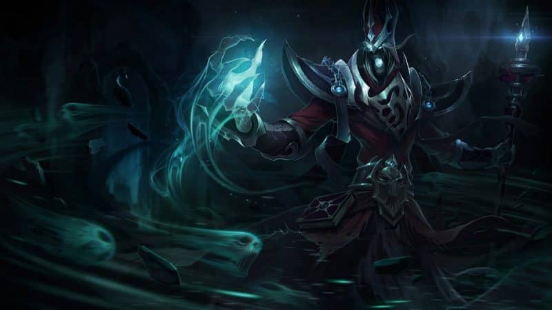 The splash art for League of Legends champion Karthus, a ghostly figure holding a staff in one hand and a blue spirit-like glowing object in the other