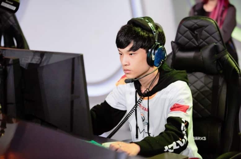 Overwatch League player Cai "Krystal" Shilong playing seriously at a computer
