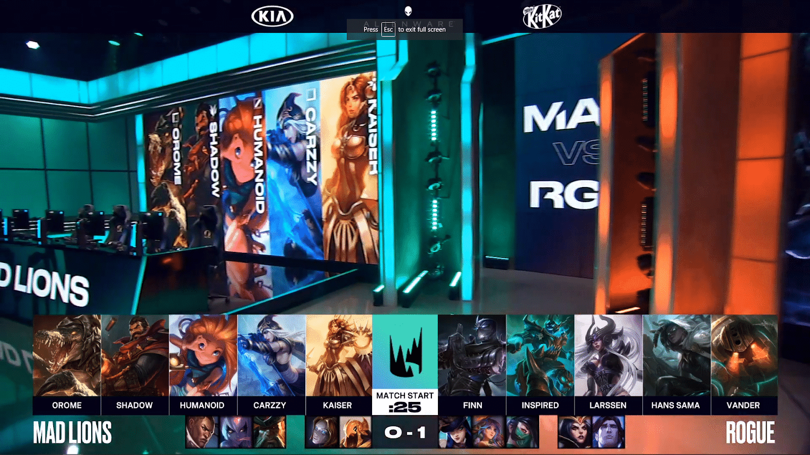 The LEC arena with computers set up and champions on large screens with MAD Lion's and Rogue's game two drafts below