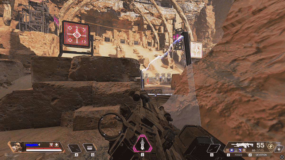 A first person view of an Apex Legends player playing Rampart in a desert battlefield