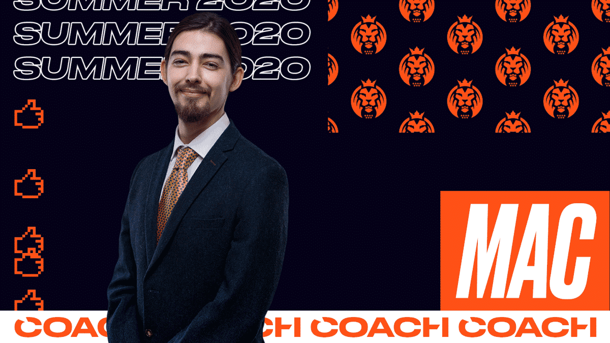 MAD Lions coach James “Mac” MacCormack wearing a suit and tie stands against a dark background. The words Coach and his nickname "Mac" appear to his left in orange and white