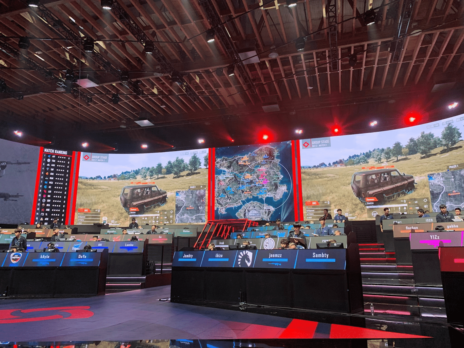 An esports arena showcasing a PUBG match with Team Liquid and 