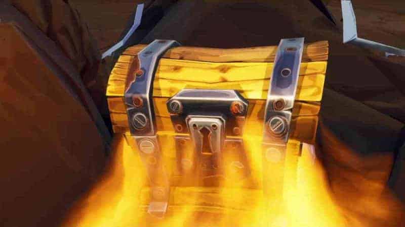 A yellow treasure chest from Fortnite emits a bright yellow glow