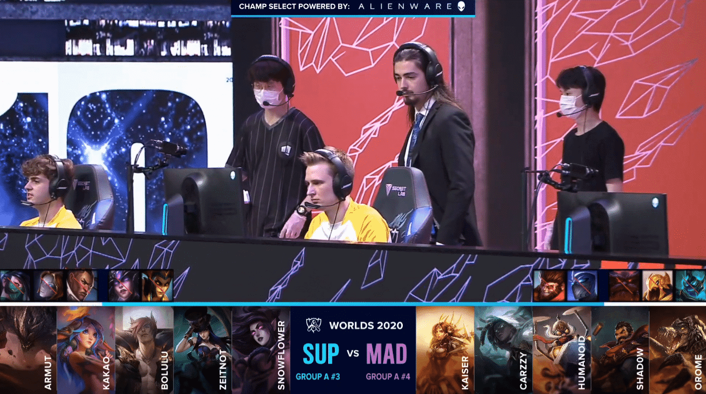 The MAD Lions coaches and players on stage before game with their game five drafts with SUP below