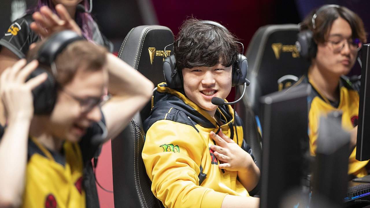 Team Liquid's Tactical smiles at mid laner Jensen with CoreJJ behind him