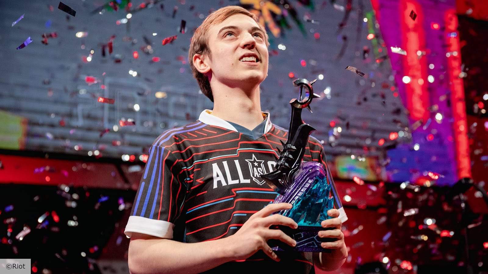 Caps looks up as confetti falls down on the stage