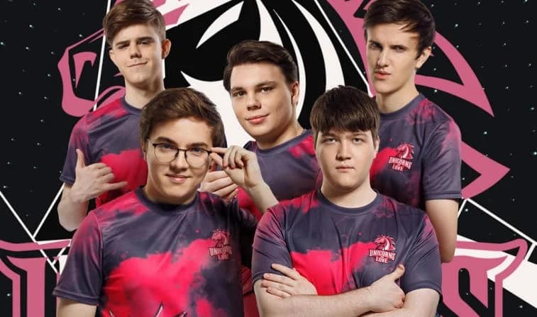 The Unicorns of Love LoL team with a large pink UoL logo behind them