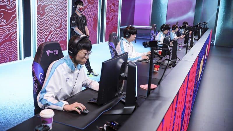 The Damwon Gaming LoL roster playing a match at Worlds 2020