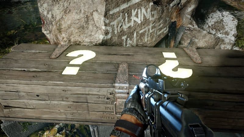 A first person POV of a CoD player with a rifle looking at the Mystery Box, a long crate with question marks on it, in Black Ops Cold War