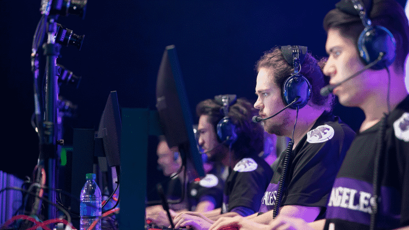 The LA Gladiators Overwatch League team playing a match on stage together