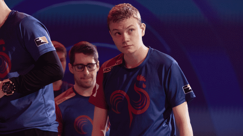 Overwatch League player Roni "LhCloudy" Tiihonen walks with his teammates and looks up to the side