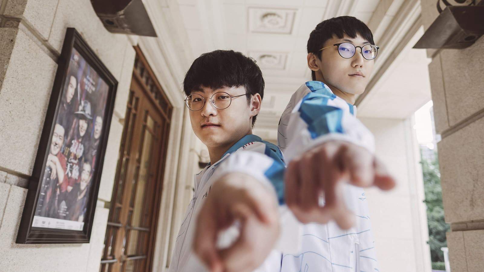 Pro Korean LoL players Showmaker and Nuguri in their Damwon Gaming attire poitning straight at the camera