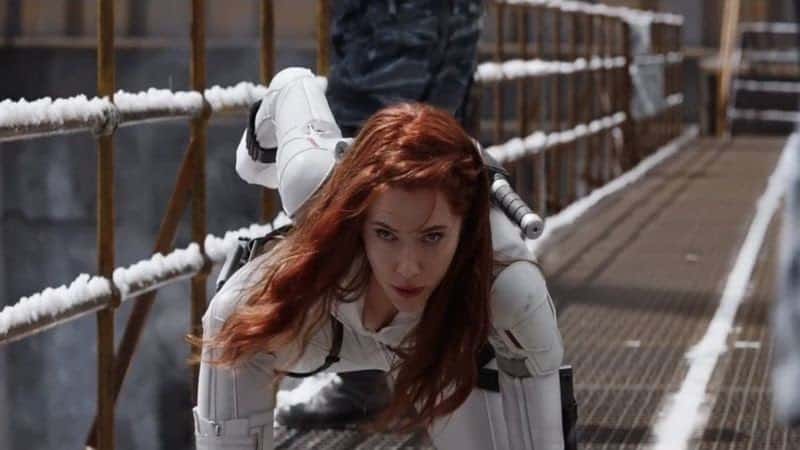 A screenshot from a Marvel movie of Scarlett Johansen playing the Black Widow crouching in a white costume