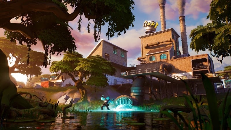 The in-game location, Slurpy Swamp, with factories and metal walkways in wet marshland terrain