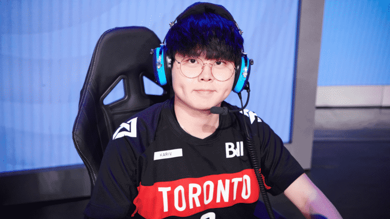 Young-seo "KariV" Park sits in his gaming chair with headset on wearing his Toronto Defiant jersey