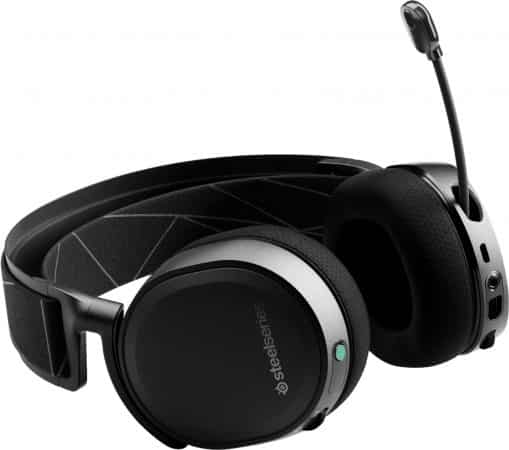 The SteelSeries Arctis 7 wireless headset with its green power button on laying down on a white background