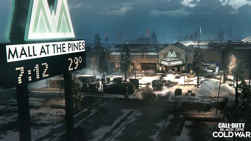 A large American style shopping mall lit up by neon lights at night is the setting for the new Black Ops Cold War map, The Pines, coming to Season 1