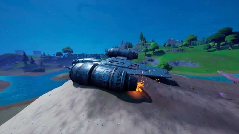 The Mythic Jetpack item sits atop a sand dune with engines running