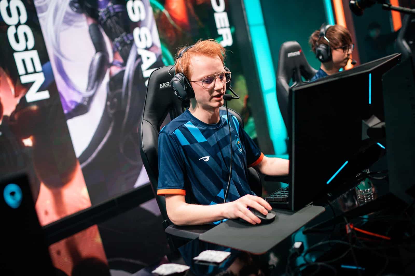 Emil Larssen makes a call through his headset during a game of League of Legends with Rogue 