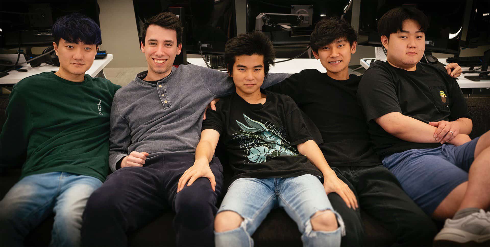 TSM players Heo "Huni" Seung-hoon, Mingyi "Spica" Lu, Tristan "PowerOfEvil" Schrage, Lawrence "Lost" Sze Yuy Hui, Hu "SwordArt" Shuo-Chieh sit together on a couch in casual attire
