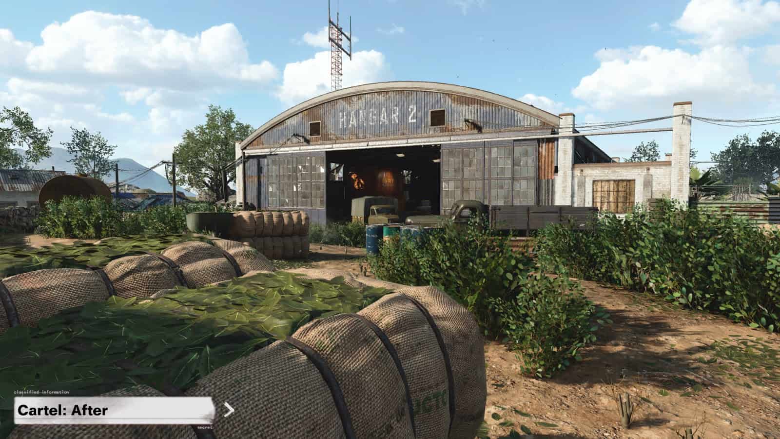 A screenshot from Call of Duty Black Ops Cold War map Cartel showcasing changes to the map. Tall shrubbery lines out paths on the way to a large airplane hanger.